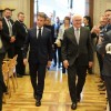 French President Emmanuel Macron and Federal President Frank-Walter Steinmeier enter the ballroom of the town hall